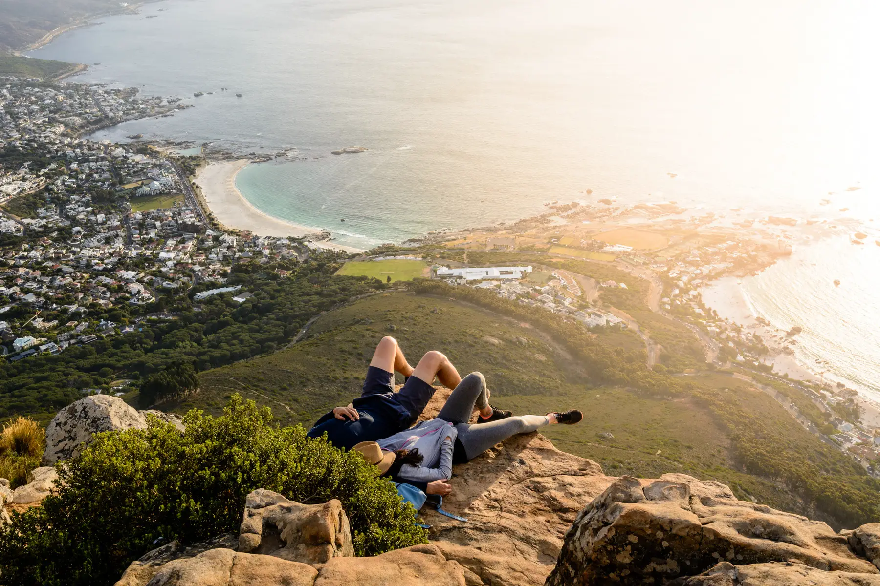 A couple enjoying the view atop Lion's Head Mountain in Cape Town