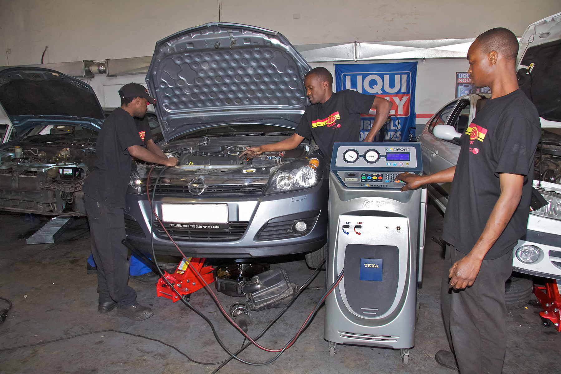 Mechanics repairing a car in Johannesburg, South Africa