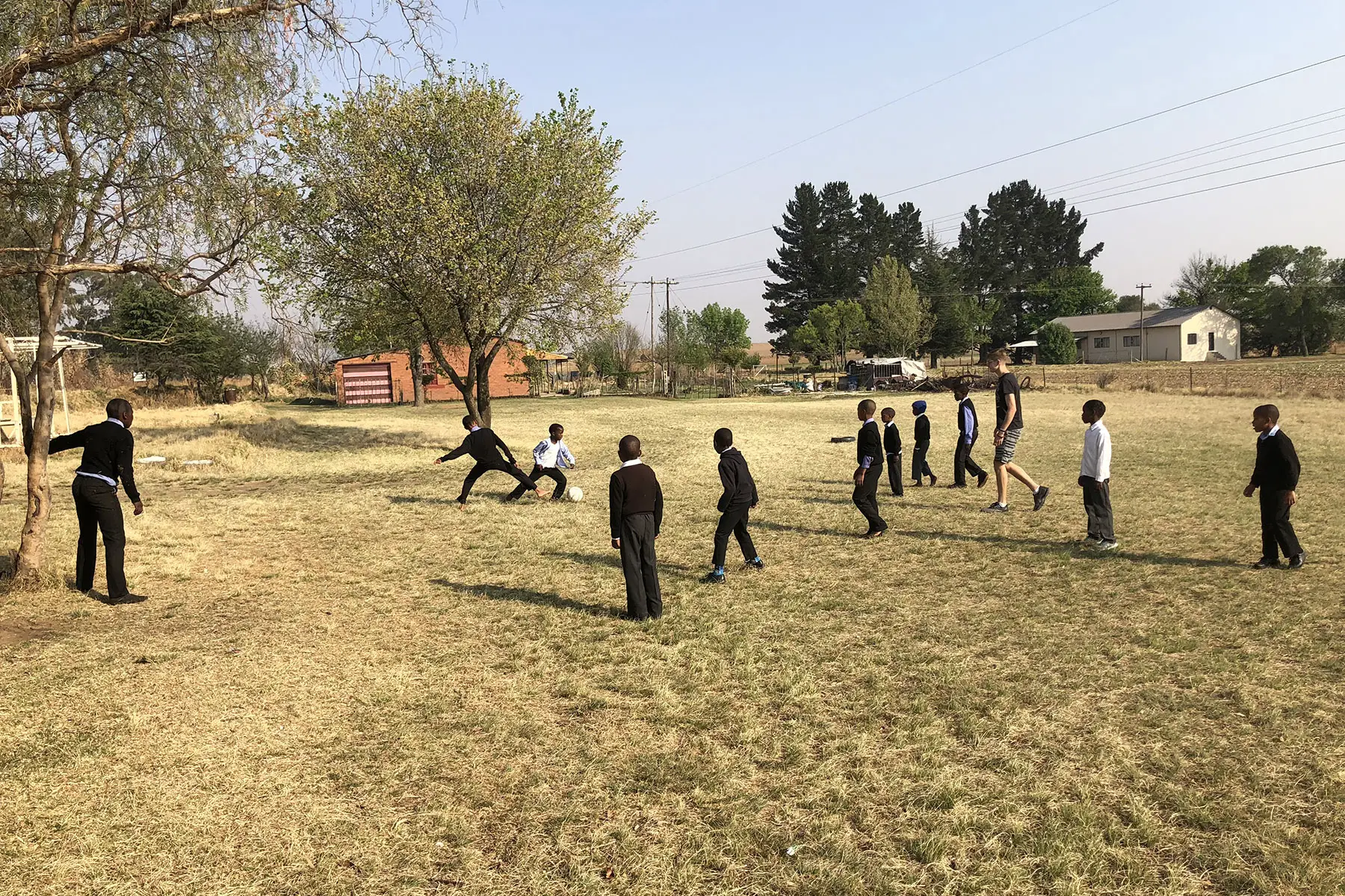 Primary schoolchildren playing football in South Africa