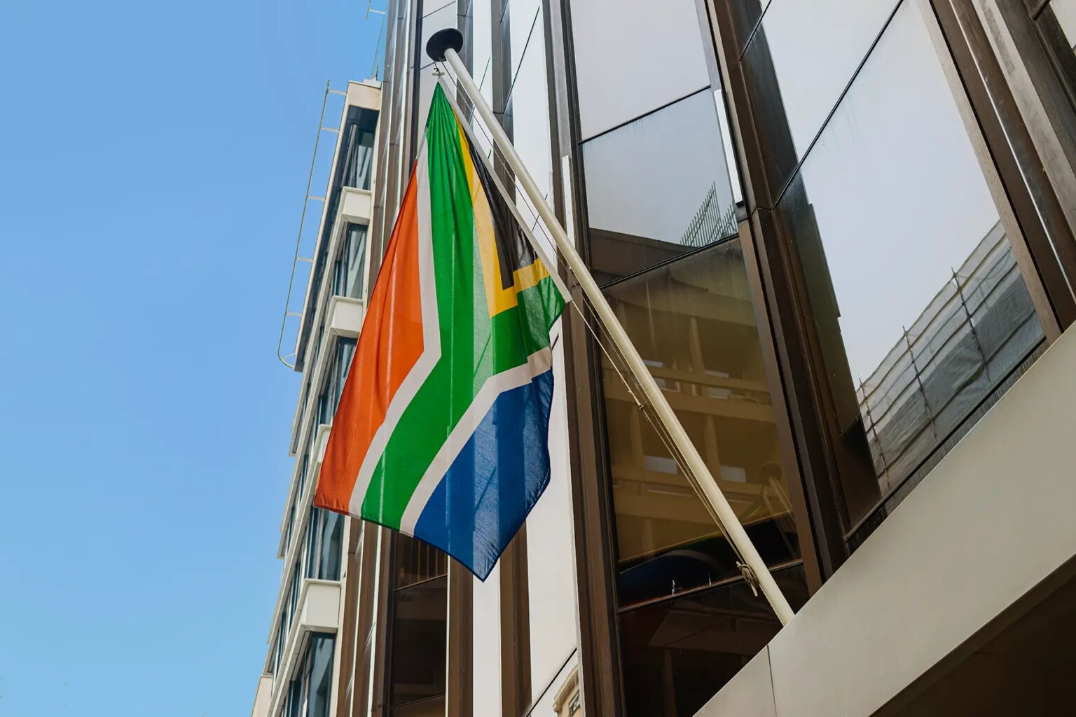 South Africa flag hanging from a building