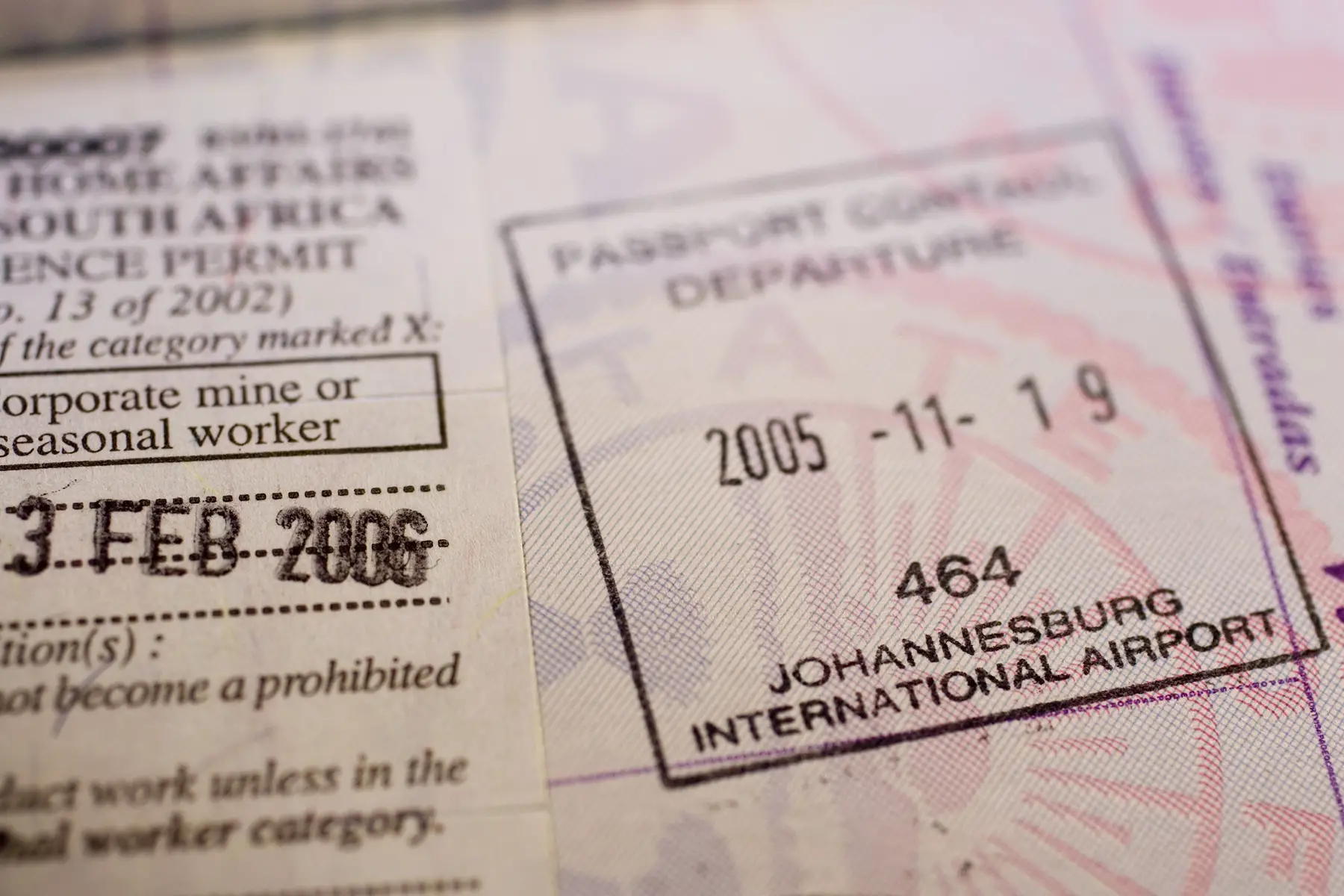 A temporary residence visa for South Africa and other stamps in a passport