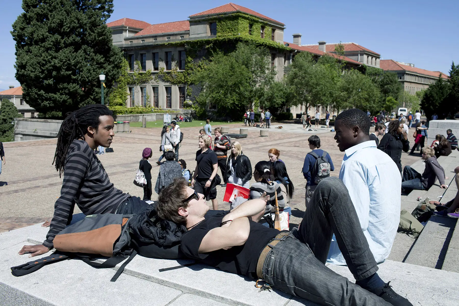 A diverse group of students relax and chat outside the University of Cape Town (UCT)
